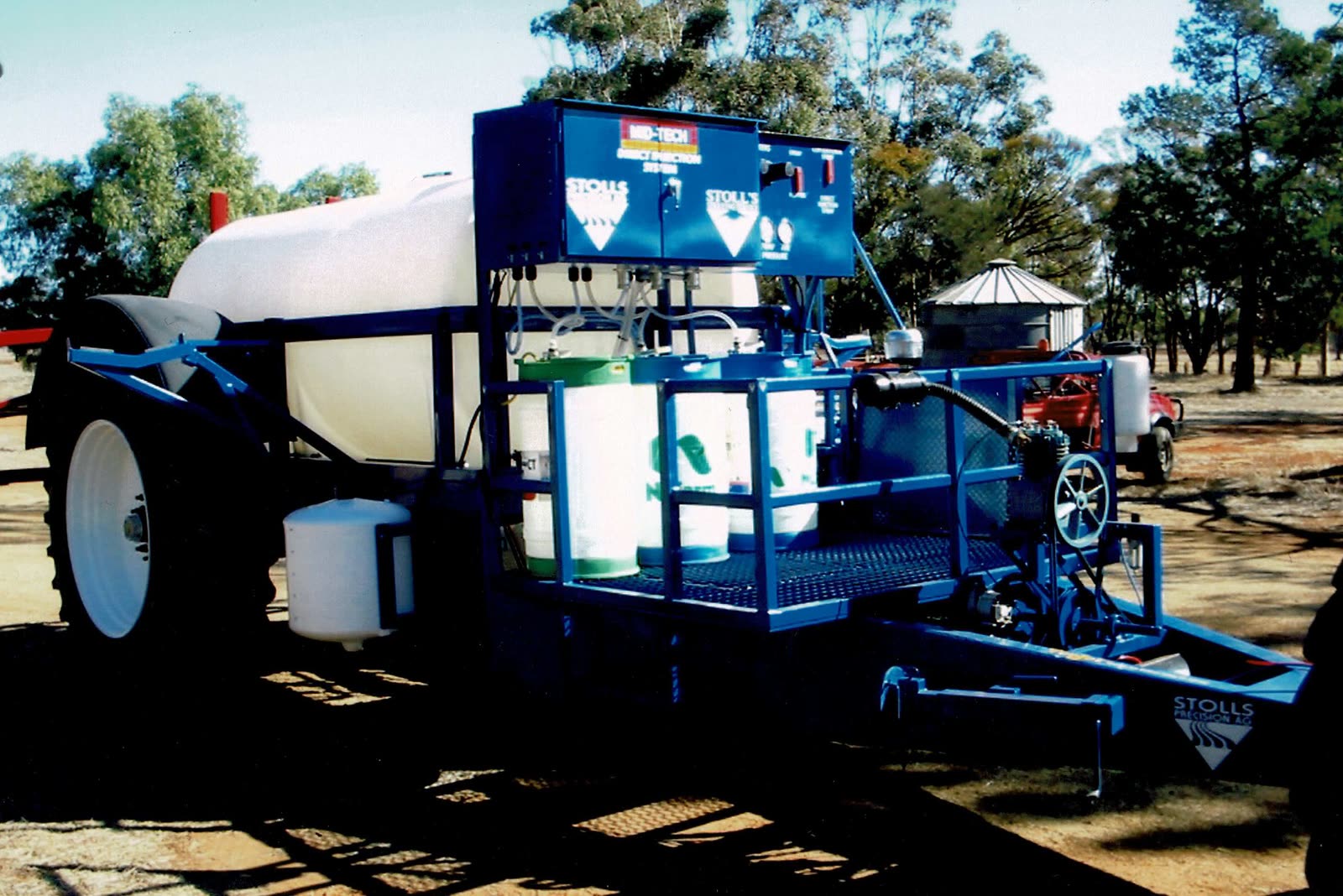 An early blue Stoll’s trailed sprayer with a chemical platform and a direct injection cabinet